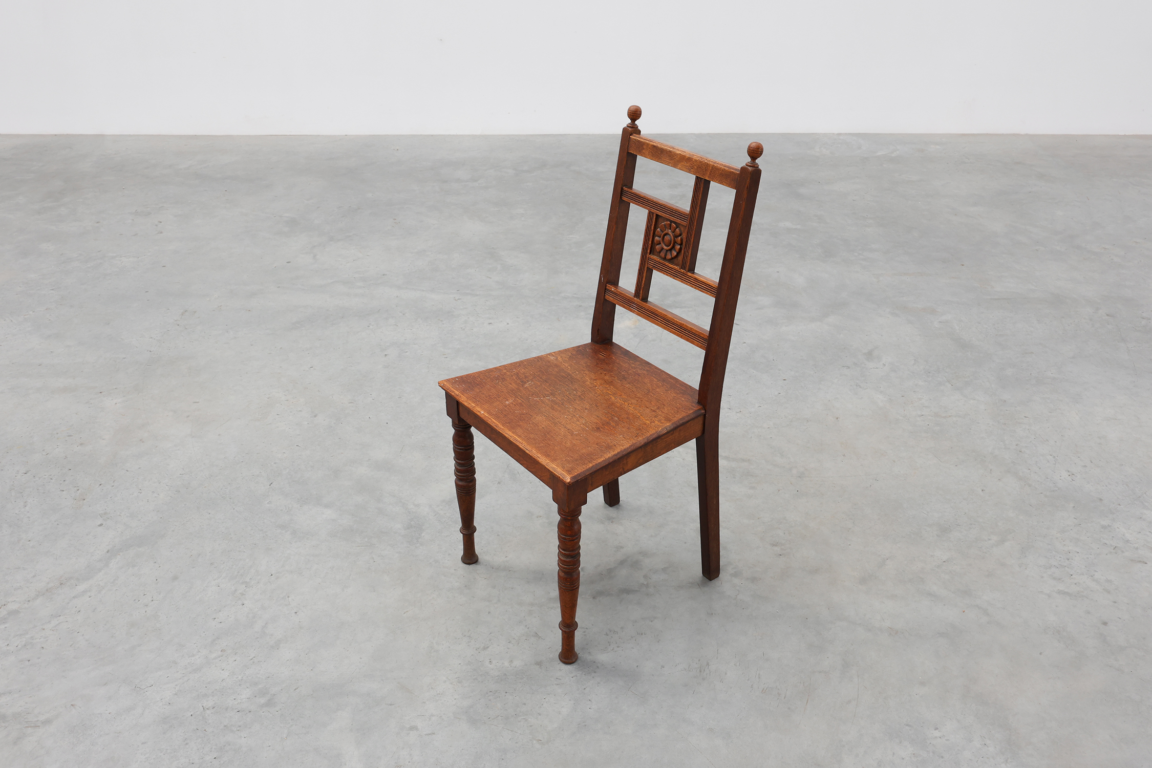 Art Deco oak side chair with carved rosette back and turned front legs, Belgium ca. 1915thumbnail
